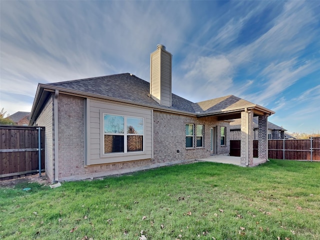 5116 Stockwhip Dr, Fort Worth, TX 76036 - back of house with a chimney, a patio area, brick siding, and roof with shingles