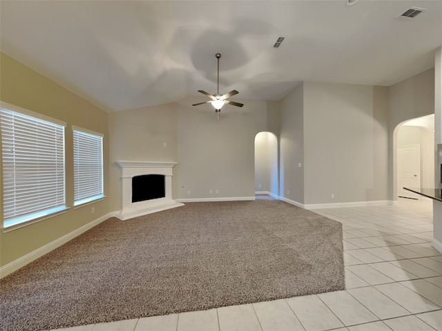5116 Stockwhip Dr, Fort Worth, TX 76036 - unfurnished living room featuring arched walkways, ceiling fan, vaulted ceiling, light tile patterned floors, and baseboards