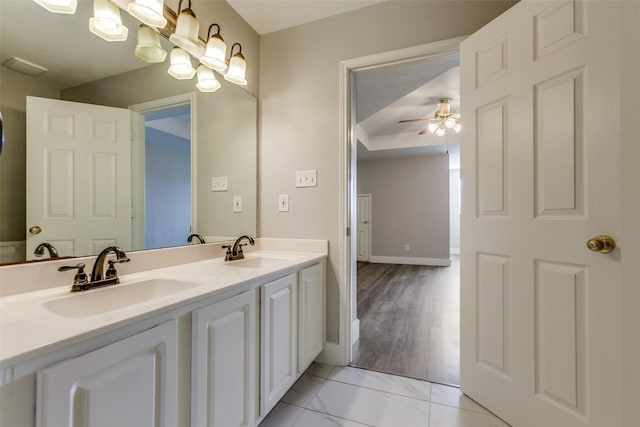 318 Mesquite Ct, Murphy, TX 75094 - bathroom with ceiling fan, double vanity, and baseboards