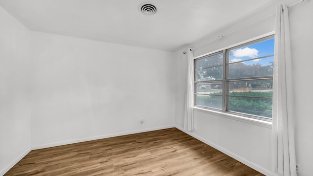 100 Oakhurst Dr, Hurst, TX 76053 - spare room with wood finished floors and baseboards