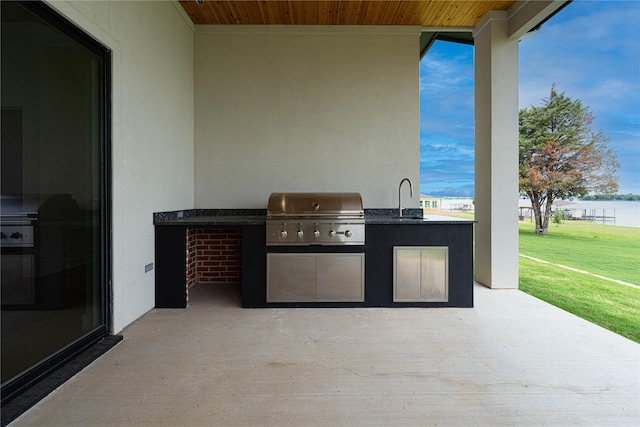 733 El Barco, Corsicana, TX 75109 - view of patio / terrace with exterior kitchen, a grill, and a sink