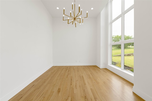 733 El Barco, Corsicana, TX 75109 - empty room with a chandelier, light wood-type flooring, baseboards, and recessed lighting