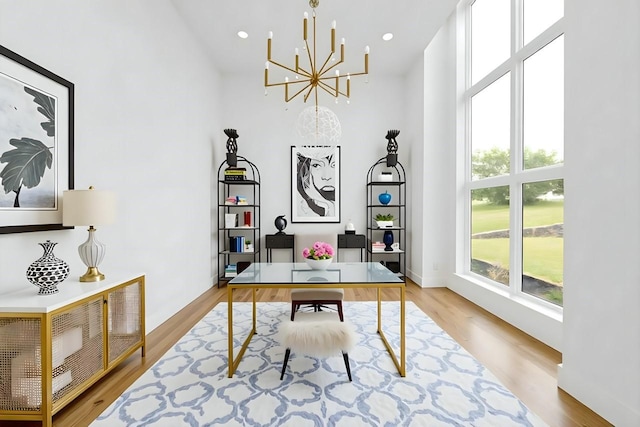 733 El Barco, Corsicana, TX 75109 - office featuring a chandelier, healthy amount of natural light, wood finished floors, a towering ceiling, and recessed lighting