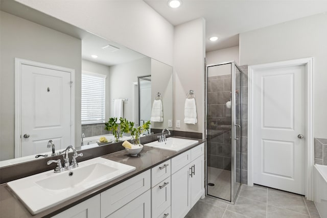5909 Horsetail Dr, Mckinney, TX 75071 - full bath with double vanity, a stall shower, tile patterned floors, a bath, and recessed lighting