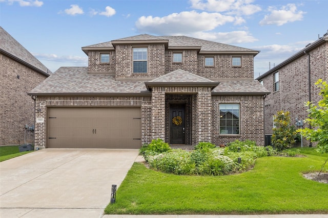 5909 Horsetail Dr, Mckinney, TX 75071 - view of front of property featuring brick siding, roof with shingles, a front lawn, and concrete driveway
