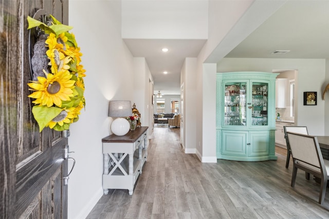 5909 Horsetail Dr, Mckinney, TX 75071 - entrance foyer featuring wood finished floors, baseboards, recessed lighting, and arched walkways