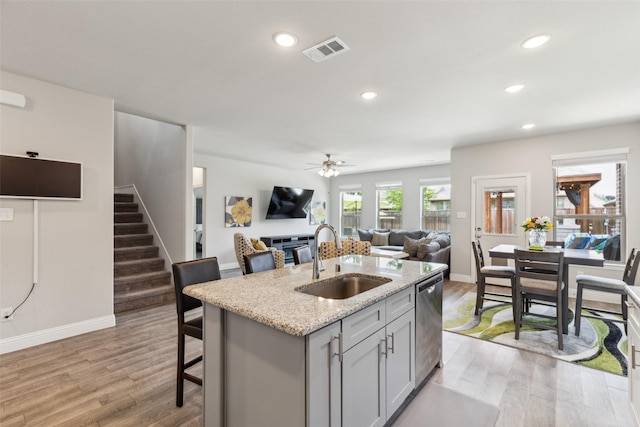 5909 Horsetail Dr, Mckinney, TX 75071 - kitchen featuring a sink, gray cabinets, recessed lighting, dishwasher, and light wood-style flooring