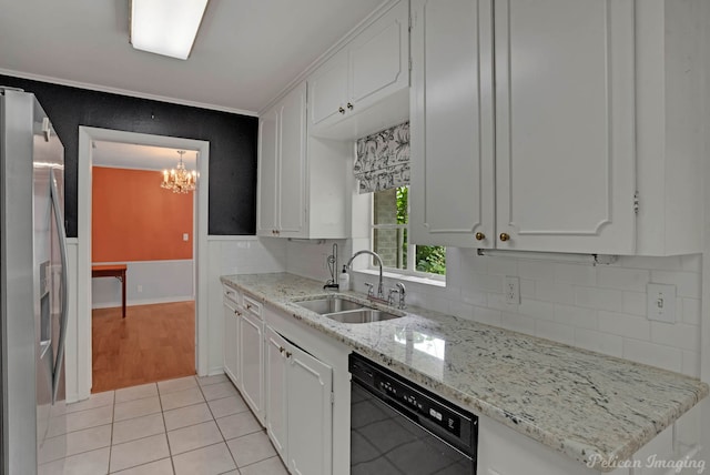 kitchen with a sink, dishwasher, stainless steel refrigerator with ice dispenser, decorative backsplash, and a chandelier