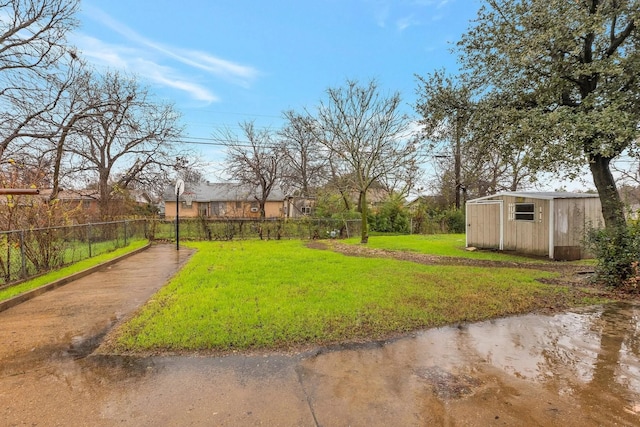 4208 Huckleberry Cir, Dallas, TX 75216 - view of yard with a shed and an outbuilding