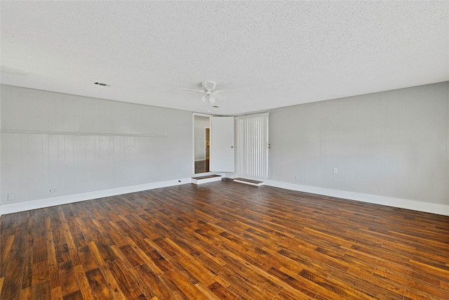 4208 Huckleberry Cir, Dallas, TX 75216 - empty room featuring wood finished floors, ceiling fan, a textured ceiling, and baseboards