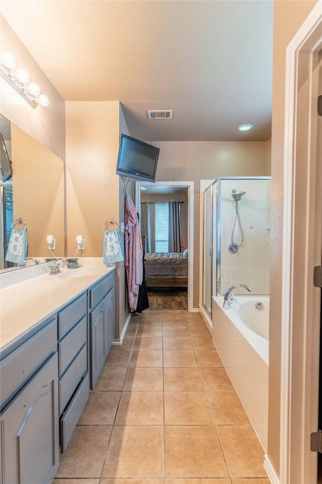 6500 Fannin Farm Way, Arlington, TX 76001 - ensuite bathroom featuring a stall shower, tile patterned floors, vanity, and a garden tub