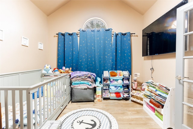 6500 Fannin Farm Way, Arlington, TX 76001 - bedroom with wood finished floors, lofted ceiling, and a nursery area