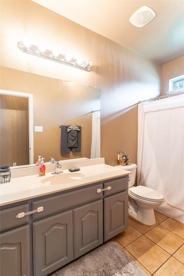6500 Fannin Farm Way, Arlington, TX 76001 - full bathroom with vanity, tile patterned floors, and toilet