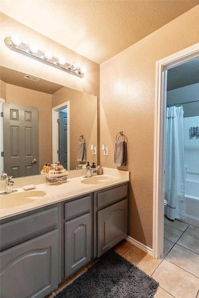 6500 Fannin Farm Way, Arlington, TX 76001 - bathroom featuring tile patterned floors, double vanity, and toilet