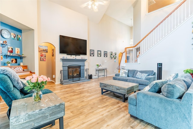6500 Fannin Farm Way, Arlington, TX 76001 - living area with a high ceiling, stairs, a ceiling fan, wood finished floors, and baseboards