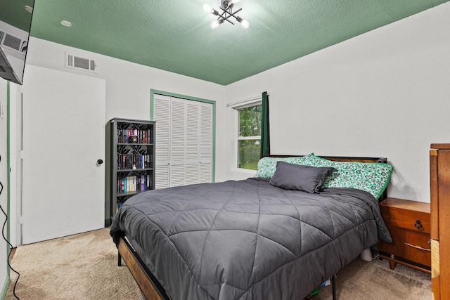 1807 W Belden St, Sherman, TX 75092 - bedroom featuring carpet floors, a closet, and a textured ceiling