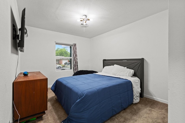 1807 W Belden St, Sherman, TX 75092 - bedroom with carpet, baseboards, and a textured ceiling
