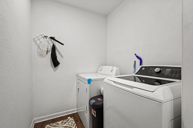 1807 W Belden St, Sherman, TX 75092 - laundry room featuring washing machine and clothes dryer, wood finished floors, and baseboards
