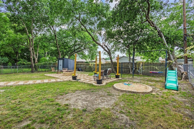 1807 W Belden St, Sherman, TX 75092 - view of yard featuring a storage unit, a patio area, and an outdoor structure