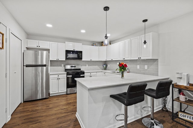 1807 W Belden St, Sherman, TX 75092 - kitchen featuring stainless steel appliances, white cabinets, a peninsula, backsplash, and recessed lighting