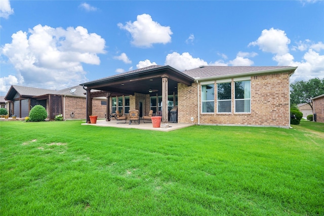 1803 Battle Creek Dr, Frisco, TX 75036 - back of property with a patio, a yard, ceiling fan, and brick siding