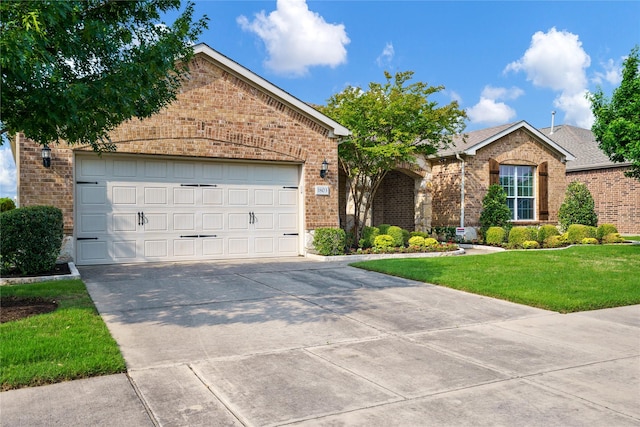 1803 Battle Creek Dr, Frisco, TX 75036 - ranch-style home with brick siding, concrete driveway, a front yard, and a garage