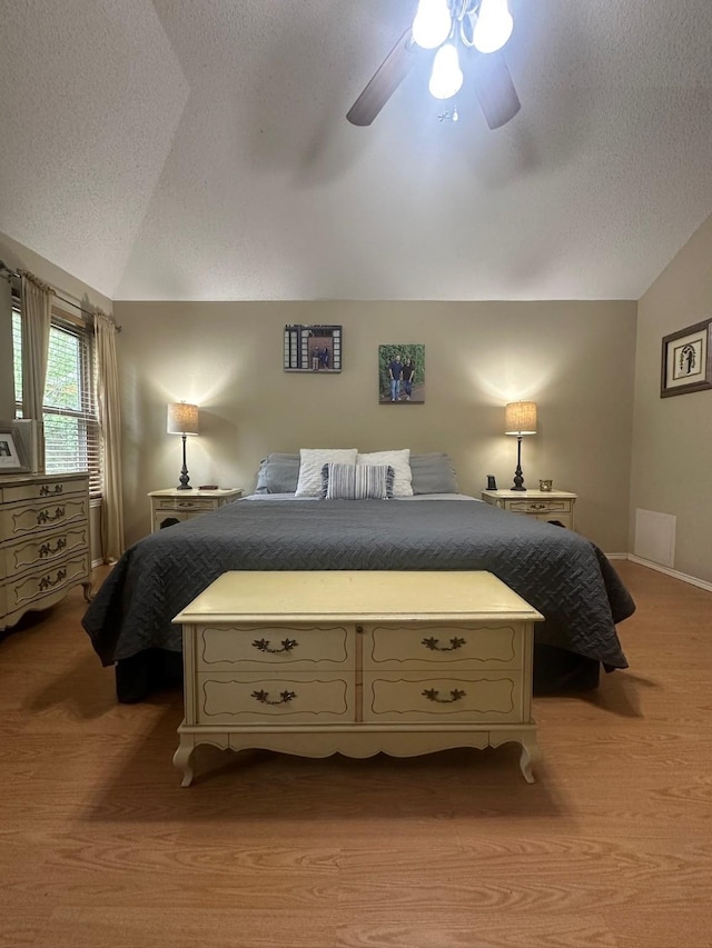 7568 Casburn Ct, Fort Worth, TX 76120 - bedroom featuring lofted ceiling, a textured ceiling, light colored carpet, and ceiling fan