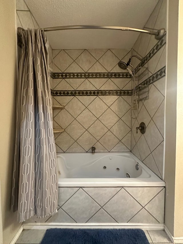 7568 Casburn Ct, Fort Worth, TX 76120 - bathroom with a combined bath / shower with jetted tub and baseboards