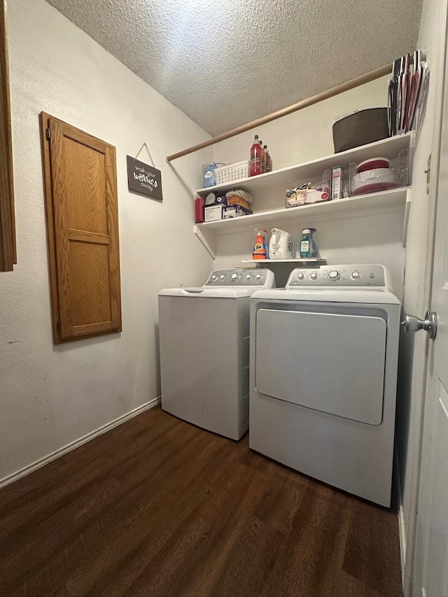 7568 Casburn Ct, Fort Worth, TX 76120 - clothes washing area with washer and clothes dryer, a textured ceiling, dark wood finished floors, and baseboards