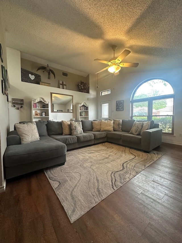 7568 Casburn Ct, Fort Worth, TX 76120 - living room with a textured ceiling, ceiling fan, wood finished floors, and baseboards