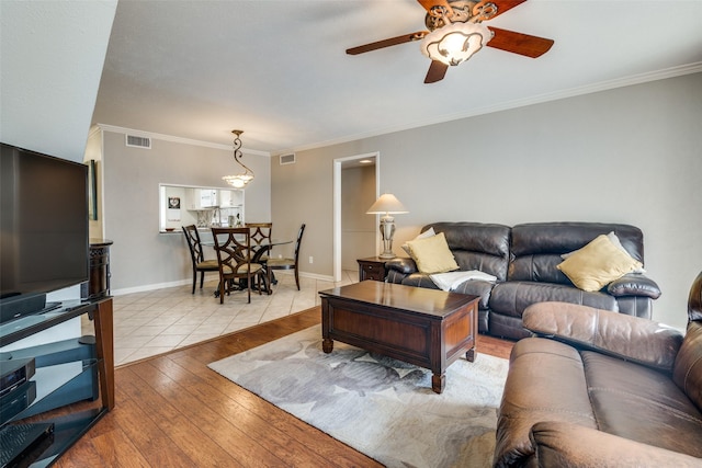 4559 N O Connor Rd Unit 2289, Irving, TX 75062 - living area featuring hardwood / wood-style floors, a ceiling fan, crown molding, and baseboards