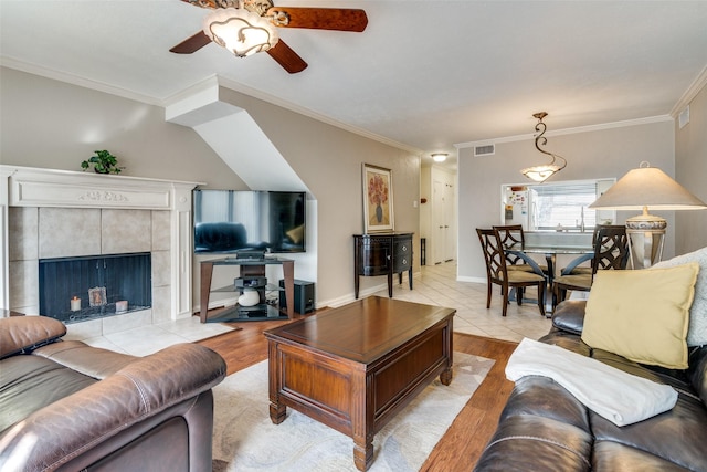4559 N O Connor Rd Unit 2289, Irving, TX 75062 - living room with crown molding, ceiling fan, light tile patterned flooring, and a fireplace