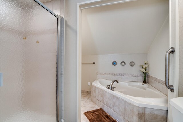 4559 N O Connor Rd Unit 2289, Irving, TX 75062 - full bathroom with a shower stall, a garden tub, tile patterned flooring, and lofted ceiling