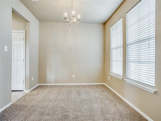 1341 Bristol Ln, Providence Village, TX 76227 - empty room featuring a chandelier, carpet flooring, and baseboards