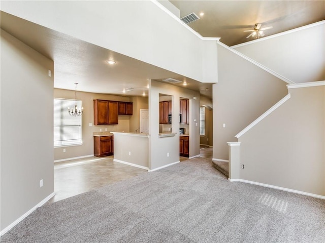 1341 Bristol Ln, Providence Village, TX 76227 - unfurnished living room with light colored carpet, baseboards, a chandelier, a ceiling fan, and stairs