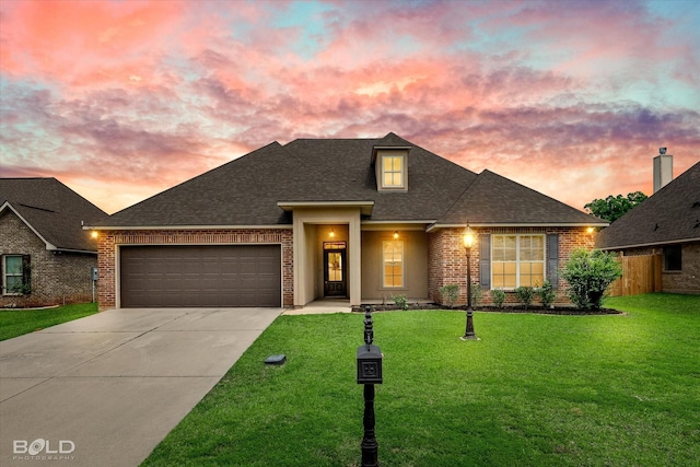9214 Mykanos Trl, Shreveport, LA 71106 - view of front of house with brick siding, concrete driveway, a garage, and a shingled roof