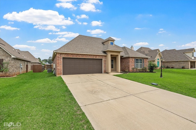 9214 Mykanos Trl, Shreveport, LA 71106 - view of front of property with brick siding, concrete driveway, a garage, and a shingled roof