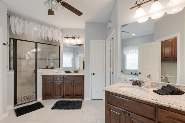 641 Hidden Pass, Royse City, TX 75189 - bathroom featuring ceiling fan, vanity, a garden tub, and a stall shower