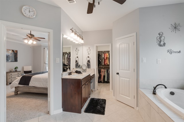 641 Hidden Pass, Royse City, TX 75189 - ensuite bathroom featuring a ceiling fan, vanity, tile patterned floors, and a bath