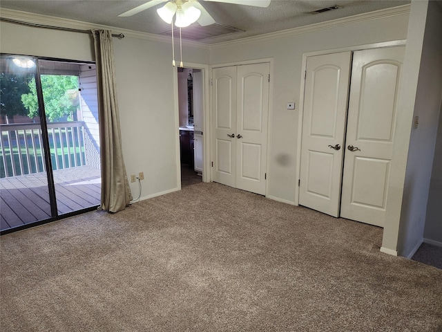 3636 Greenacres Place Dr Unit 45, Bossier City, LA 71111 - unfurnished bedroom featuring access to exterior, carpet, crown molding, baseboards, and two closets