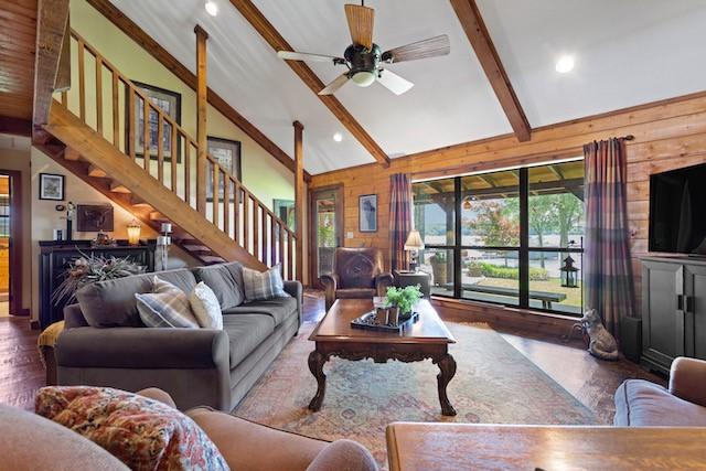 16887 Rainbow Ridge Cir, Tyler, TX 75707 - living area featuring beam ceiling, wood finished floors, high vaulted ceiling, stairs, and a ceiling fan