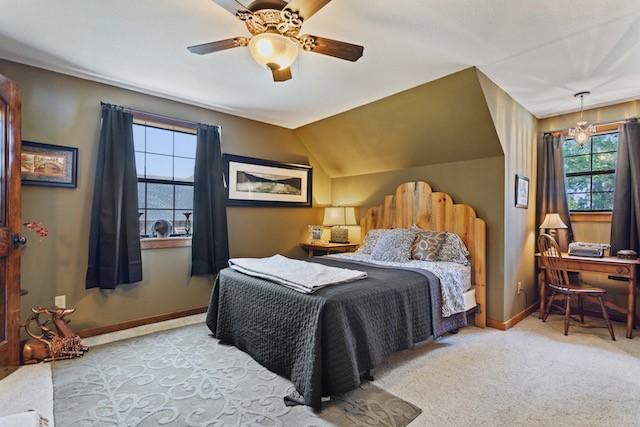 16887 Rainbow Ridge Cir, Tyler, TX 75707 - carpeted bedroom featuring multiple windows, baseboards, a ceiling fan, and lofted ceiling