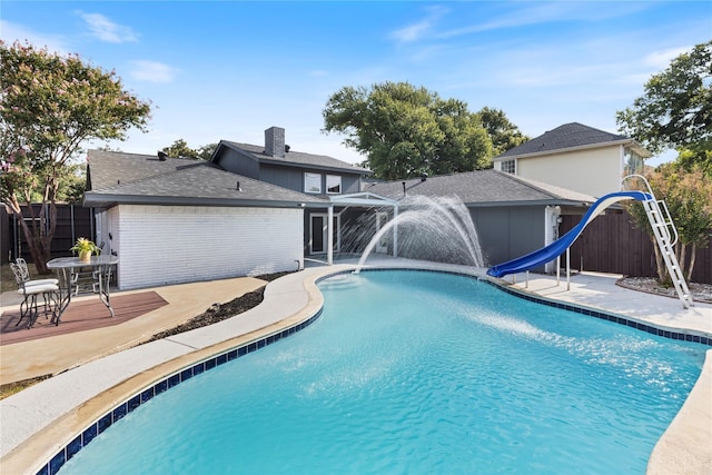 2324 Claridge Cir, Plano, TX 75075 - view of pool featuring a water slide and a deck