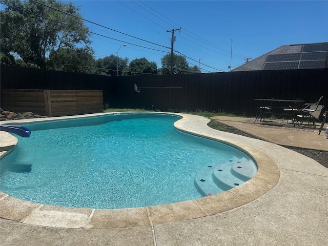 2324 Claridge Cir, Plano, TX 75075 - view of swimming pool with a fenced backyard, a patio area, and a water slide