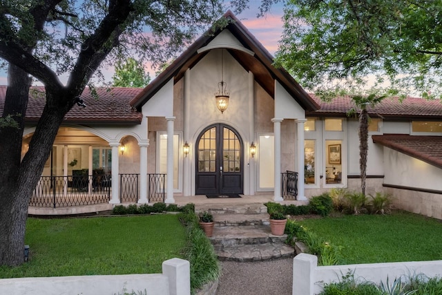 6181 Preston Creek Ct, Dallas, TX 75240 - view of front of home featuring french doors, a yard, and stucco siding