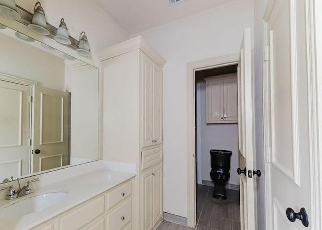 215 Harvest Rdg, Mclendon Chisholm, TX 75032 - bathroom with vanity, baseboards, and wood finished floors