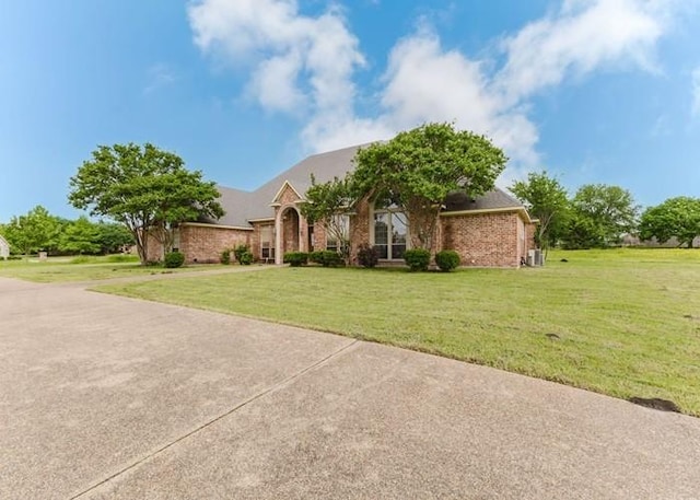 215 Harvest Rdg, Mclendon Chisholm, TX 75032 - view of front of property with a front lawn and brick siding
