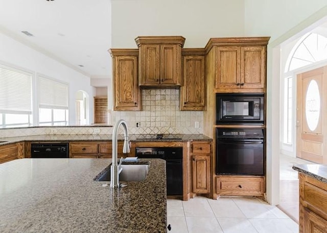 215 Harvest Rdg, Mclendon Chisholm, TX 75032 - kitchen with black appliances, a sink, brown cabinetry, tasteful backsplash, and crown molding