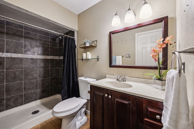 539 Hightrail Dr, Allen, TX 75002 - bathroom featuring vanity, toilet, a stall shower, and wood finished floors