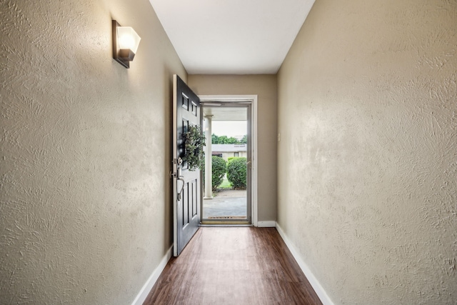 539 Hightrail Dr, Allen, TX 75002 - doorway to outside with wood finished floors, a textured wall, and baseboards